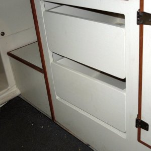 Used a good latex satin match tinted to surface of cabin plywood finish.