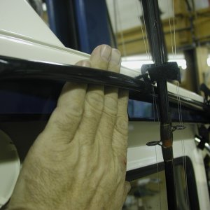Rod protector: Rubber hose screwed to cabin roof edge.