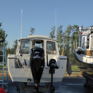 After the first project of the day (helping Brock with an errand), I returned to the boat to install the 6 hp high thrust Sail Pro as the permanent kicker for Big C.  The Suzuki 6 hp and 9' Achilles will soon be replaced with a lighter, dedicated package.