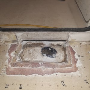 cut out the dam and drilled a few more holes to help the sump dry out. this sump is not cored underneath, solid glass (I think)