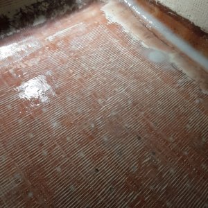 glassed over, 6oz cloth over the whole sole.  2 layers thick in the aisle area