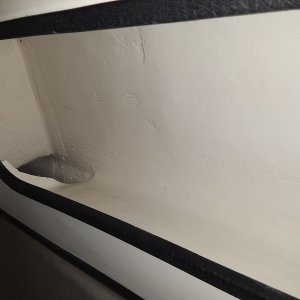 under the gunnel shelves had broke loose from the side of the hull.  I put a fillet and some glass to reattach and then painted it all up.  looks really good now and is solid