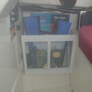 Storage rack under helm