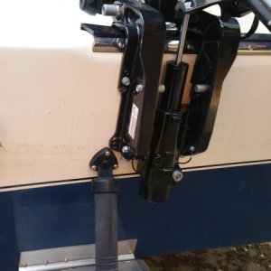 Media 'View of kicker motor bracket in relation to trim tab hardware' in album 'Brand new-in-box motor'