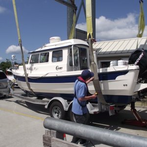 Jacking up back of boat for sling launch strap