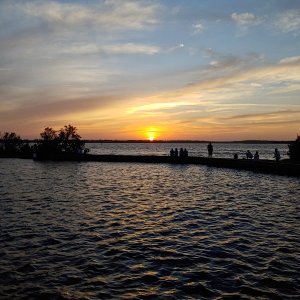 Bunches of folks showing up to watch the sun go down at Carolina Beach State Park.