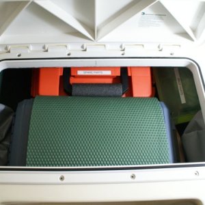 V-Berth Storage Install -DSC06195 A left over piece of foam pad was perfect for helping to keep things snug and quiet.
