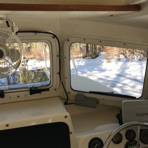 Opening center window, 12 volt fan and windshield wiper on port window.