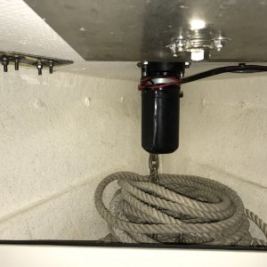 Anchor locker with vertical windlass.
