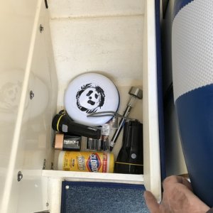 Port foot locker in front of helm seat.