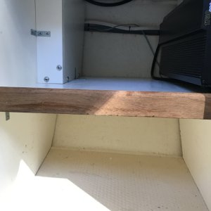 Storage cabinet under helm seat with 1,750 watt inverter.