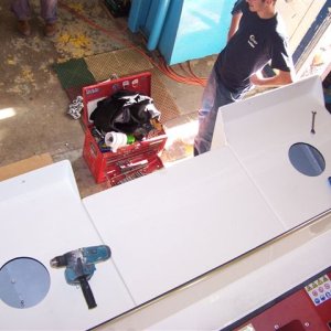 (Cygnet)No vertical rails, just hand holds in key spots.  Additional 16 sq ft of deck space.