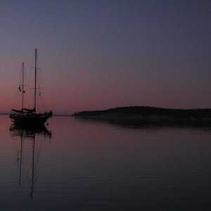 Sequim Bay sunrise.  Quiet water, and empty dock, accessible solitude. What a relief.
