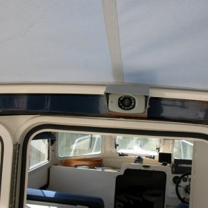 LCD Backup Camera above cabin door. The small 'black dot' to the left of the lense is the mic pickup. I use the mic to monitor the cockpit crew for docking or other feedback.