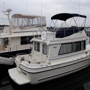 Slow Lane at the marina where I bought her. Next to a nice Mainship 40 trawler