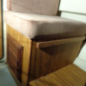 Louvered door added to storage area under the seat where the water tank used to be.