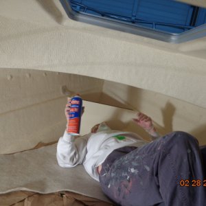 Spraying glue - wearing eye protection, head covering, face mask, gloves and plenty of ventilation, too.