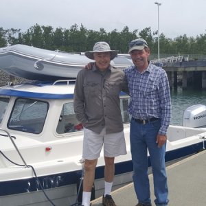 Brock with his buddy Mark.  Check out that beautiful brand spanking new boat and motor, Honda 150!