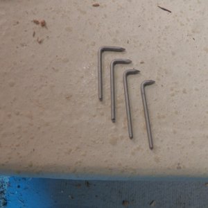 Here are the homemade clean out tools.  Bent nails.  I start with the smallest bend in a drill that has a clutch and work my way up, if needed.  When I hit solid wood, the clutch slips or the nail bends.  I go on a little further to make sure that I have gotten all the rotten wood.  This does not mean that I have come to dry wood!