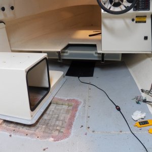 Another picture of the removed balsa showing the scarf joint preparation for connecting the new epoxy/glass top laminate.  I knew that there was a reason I hated fiberglass boats.  Grinding down the glass was horrible.  Also shown is a 160 degree heating pad that is moved around over the cockpit sole to drive out moisture.  I also used heat lamps under the boat.  Be careful with those.  They can get very hot.