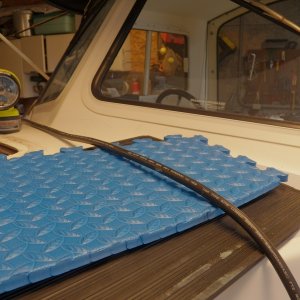 A floor heating pad is placed on the deck with foam insulation above it.  The heater gets up to about 160-170F, which is hot enough to kill dry rot spores in the deck, but not hot enough to damage the fiberglass laminate.  It is moved every couple of hours to allow the heat cycling to drive moisture out and dry air in.
