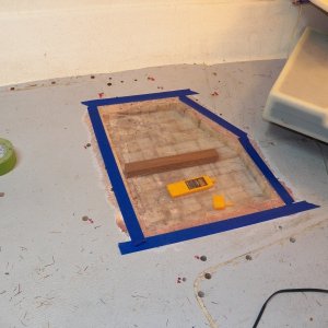 The deck has now been opened for two months in a heated garage with a heating mat placed on the deck and heat lamps underneath.  Here, I covered the opening in the deck with plastic with a psychrometer (air moisture meter) enclosed.  Relative humidity in the garage was now down to 50%.  After 24 hours applying heat to the surrounding area, it only got to 60% RH inside of the plastic.