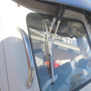 Standard 11.5" wipers and arms replaced with Pantographic arms and 14" SS Deluxe wipers. Adjustment of the 14" wiper position is straight forward with plenty of room for a full sweep. Adjust it parallel to the side in the park position. Either the SS Deluxe or SS Standard wiper(cheaper) could be used.