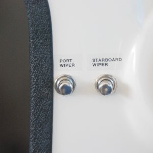 Helm wiper momentary control switches labeled.