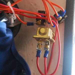 Helm Wiper Motor/Washer Switches.

 The added Washer Switch is the larger bottom switch. An in-line fuse holder is located abt 2" from HOUSE 12V BUSS feeding the Washer Switch.