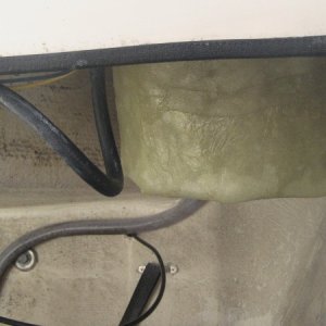 Sits down, but will be covered by tank front
