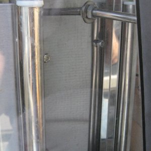 This is the rear of the mount...the solid bar mounts to where the bolt is on the outside hand hold..