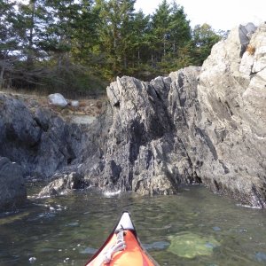 Exploring the various rock formations on the outside of Watmough bay