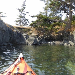 Exploring the various rock formations on the outside of Watmough bay