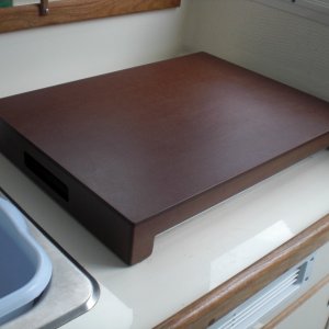 Wallas countertop made out of PaperStone. Waterproof, scratchproof, heatproof, rotproof, mildewproof. Clean with soapy water. Doubled the amount of galley counter top. Can also be used as a cutting board.