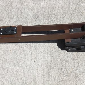 BBQ holder.  Made an arm, attached to a Scotty downrigger base.  Easily removed with one bolt and a wingnut.