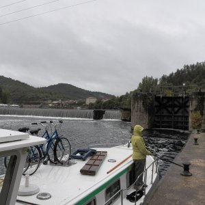 Our 11 meter bare boat charter preparing to go through a lock.  We did about 5 or 6 a day, depending on which section of the river we were on and how far we wanted to go that day.  The showers didn't dampen the adventure.