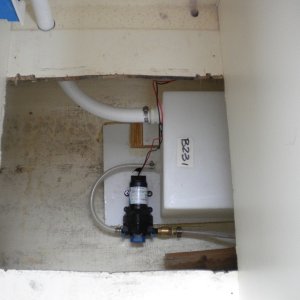 Tank and pump secured. Straight fitting used instead of 90 to relocate filler tube and deck plate.