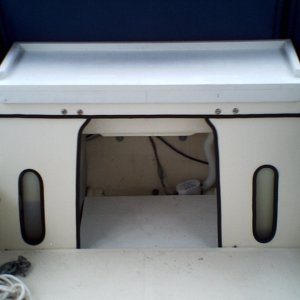 1.  Table/bench seat fits over transom.  Made from scrap PVC planks.
2.  Scrap PVC planks cut to fit over raised edges of bilge area.  This allows use of bilge area w/o stowing any gear in water