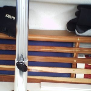 See through stowage area between seats and port bulkhead.  Cut-to-fit piece of wood lays in top to facilitate better use of the area