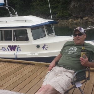 Captain Rick in front of his prized possesion, C-Dawg, a great fishing machine.