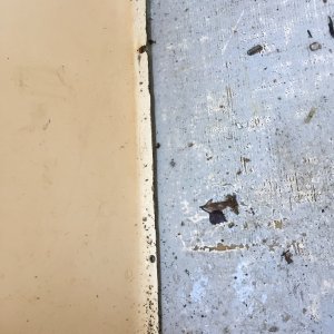 Rivets fastening side panel to deck have  almost all corroded and fallen out, leaving open holes to the balsa core.