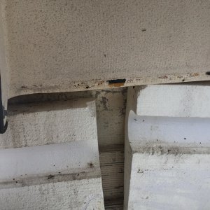 The black edge-cover on the side panel was glued to the hull - a few taps on a pry-bar with a hammer broke it free.