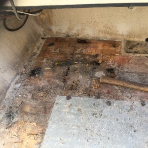 Media '' in album 'Rivets fastening side panel to deck have  almost all corroded and fallen out, leaving open holes to the balsa core.'