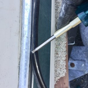 Re-inserting rubber part in rubrail channel.