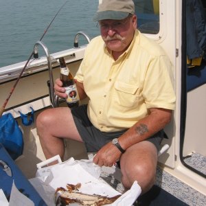 Media 'Good Friend and fishing buddy Ira. Excellent weather, calm water, imported German weiss beer, smoked whitefish for lunch, fresh herring in the cooler - Life is great!' in album 'Anchorage view from cove on North side of Lime Island. Great way to end a perfect day of fishing.'
