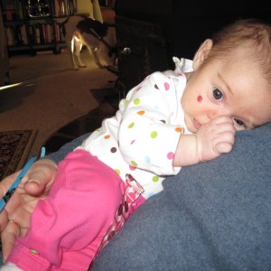 Wide-eyed Harper Snuggling with Nana 12-31-10