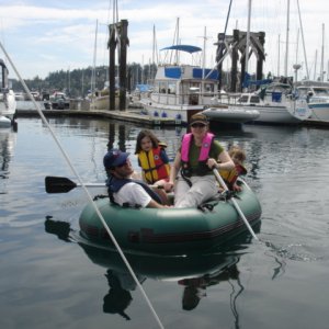TWO LUCKY FISH crew 
trying out an Alaska
Series dinghy