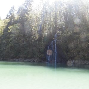 The water is this color because the headwaters (the Lewis river) are snow melt containing glacial "rock flour."