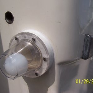 Media '2 WARNINGS:

your thru hull drain must have a 3/4" downward slope to it or the scupper will hold water in when you wash the cockpit.  Second if you drop the gasket in the water once it is a foot down you can not see it.  In 3' of water I tied a string to the other gasket and dropped it in, all I could see was the knot in the string!  I ordered a second one.' in album 'The old rubber flappers had warped allowing water back into the cockpit area, so I decided to replace them with Rabud ball scuppers.'