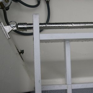 Detail showing 7/8" stainless railing, fittings and connection to motor well.  Rack pivots up for access to well.